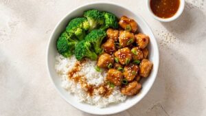 Honey Garlic Chicken Rice Bowl Honey garlic chicken rice bowl with broccoli and sesame seeds