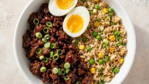 BBQ Beef Rice Bowl BBQ beef rice bowl with gochujang beef, fried rice, and a jammy egg