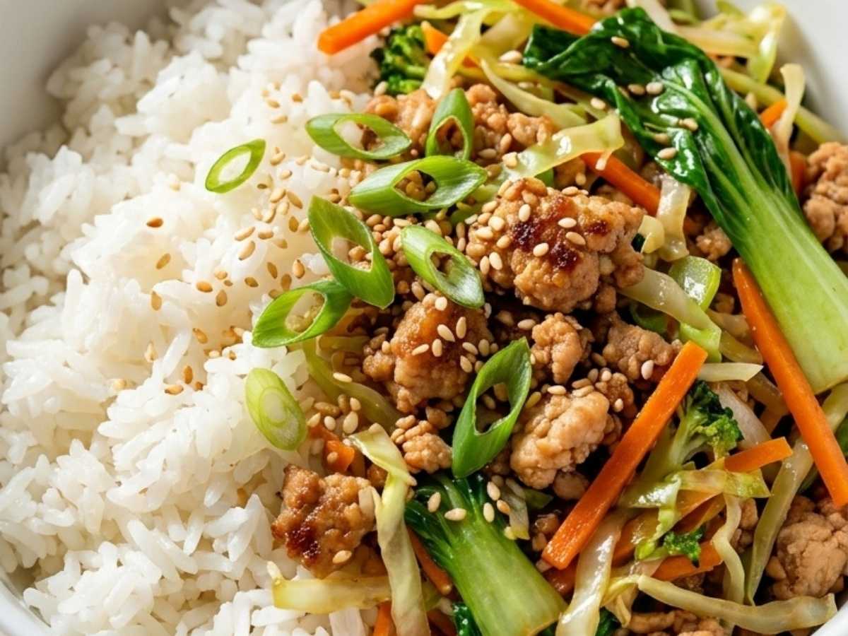 Close up of Chicken Egg Roll Bowl showing ground chicken, cabbage slaw, and scallions